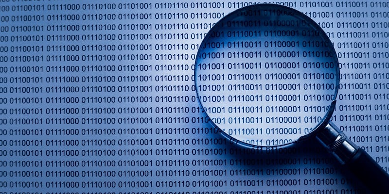 magnifying glass over binary - data profiling