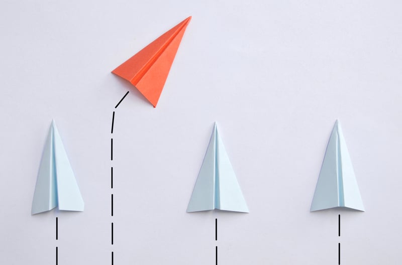contrarian mindset paper airplaines 